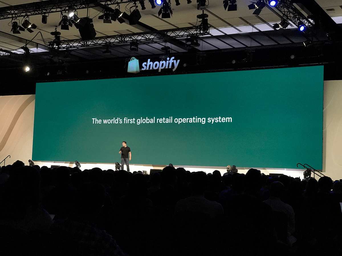 retail operating system presentation presentation at Shopify Unite 2019 with Harley Finkelstein standing on stage